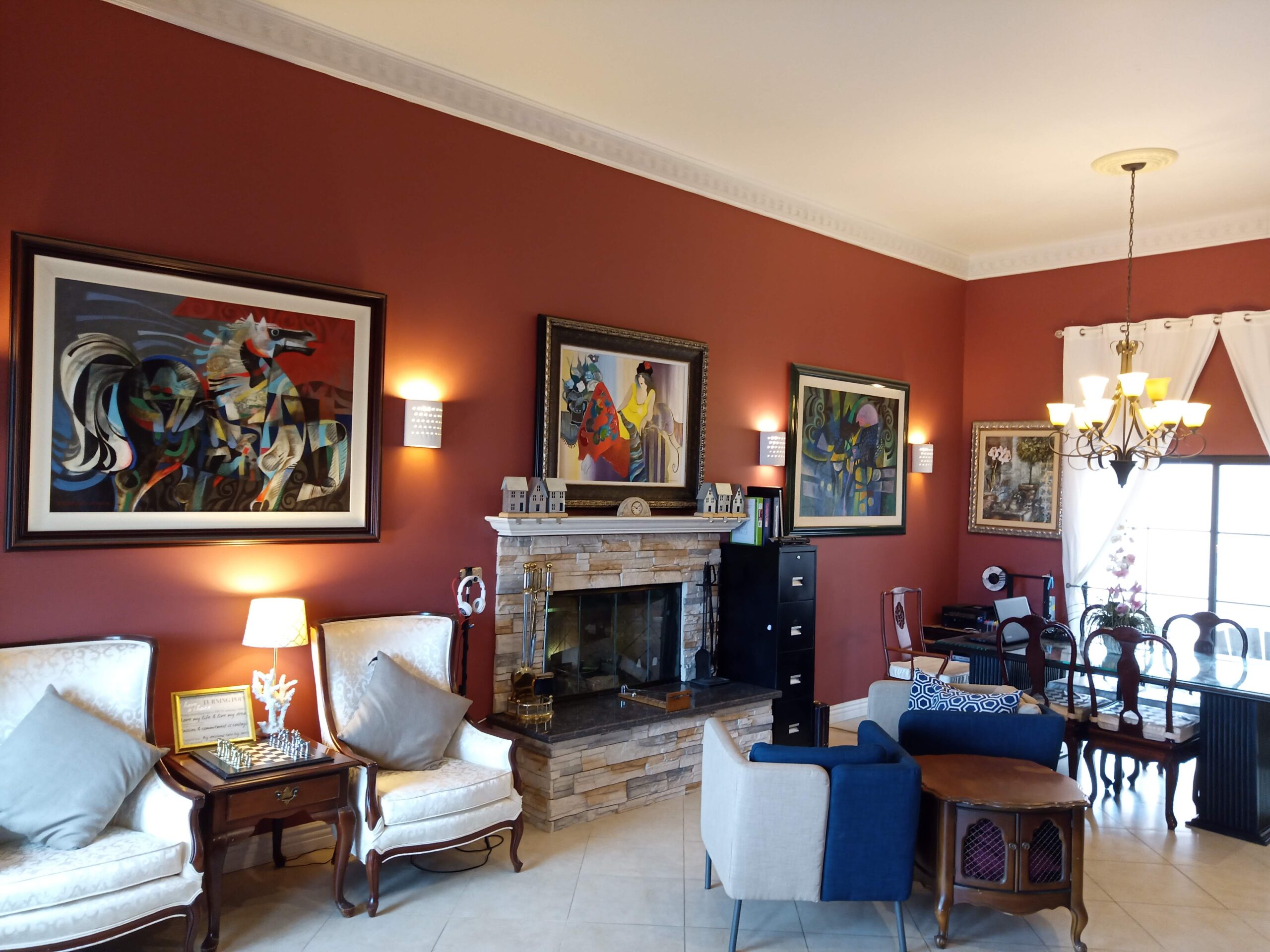 Warm interior lounge with artwork and furniture.