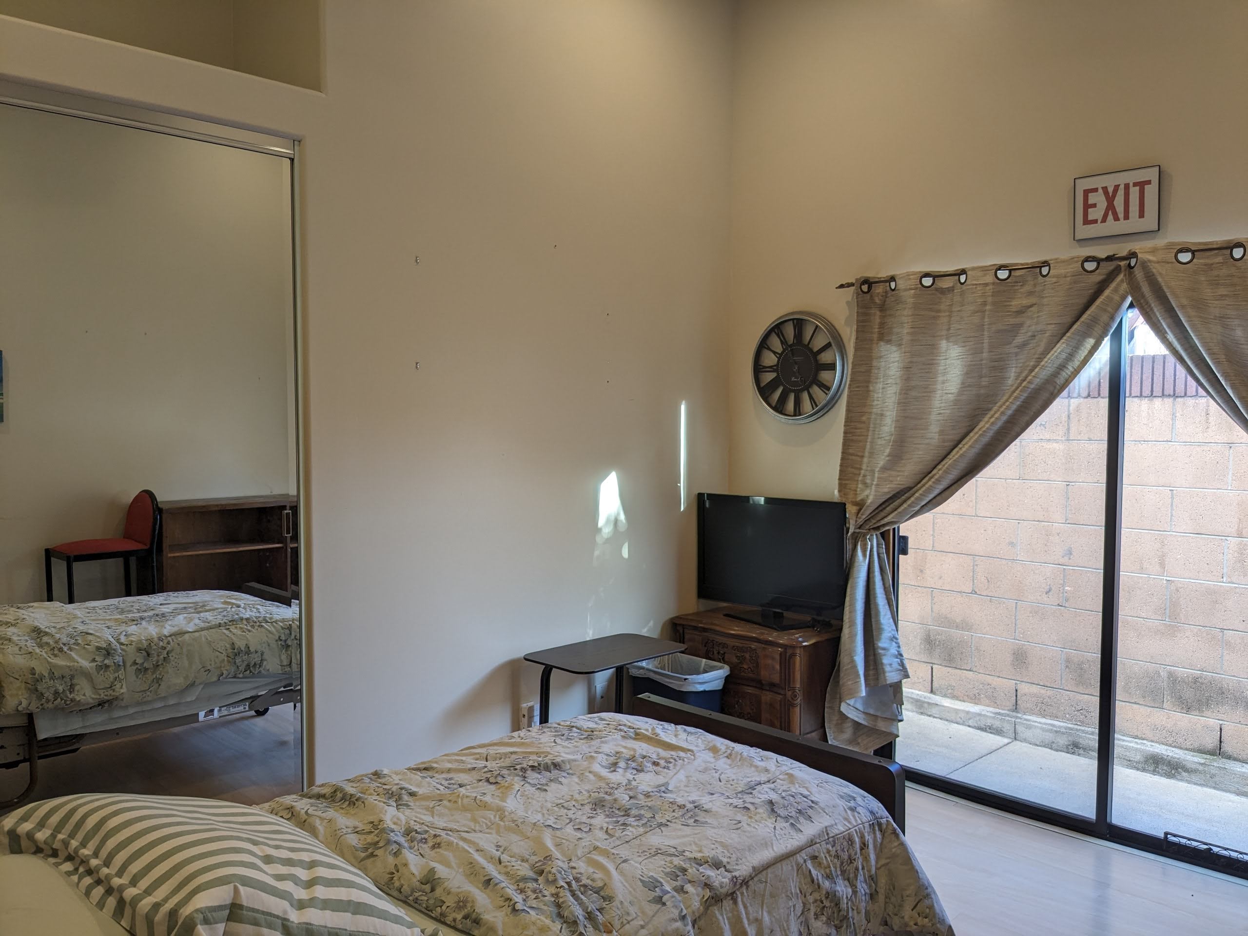 Private resident room with a bed and TV