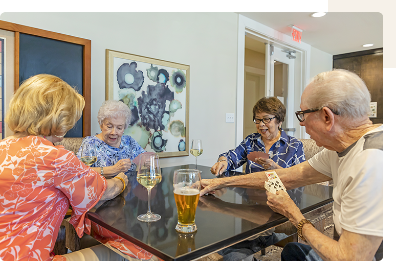 Residents enjoying a card game together.