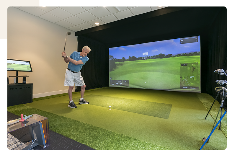 Resident enjoying indoor golf activity.