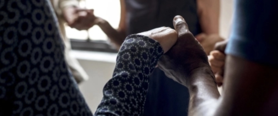 Close-up of hands in supportive interaction