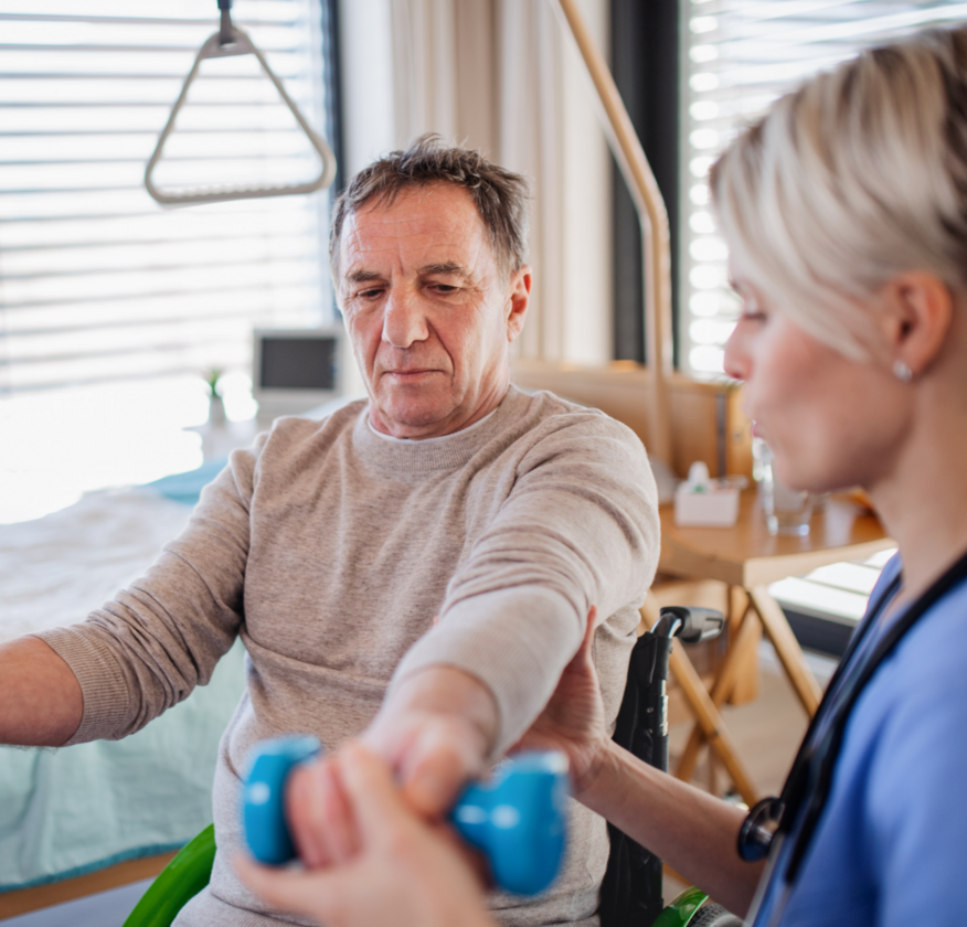 A senior man exercising with therapy weights.