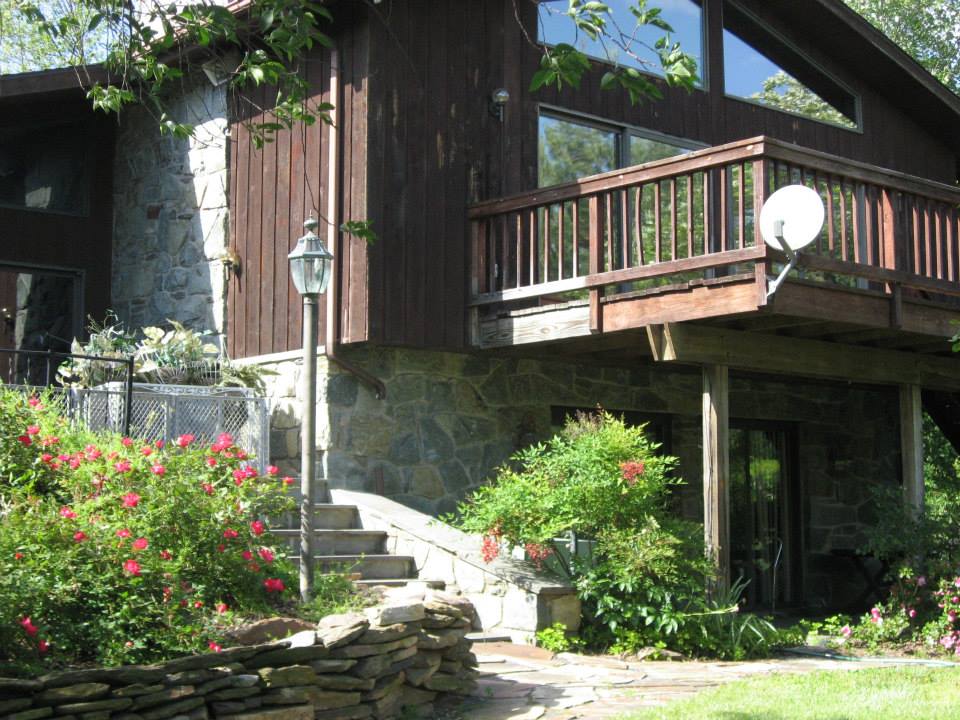 Exterior view of a senior living building with garden