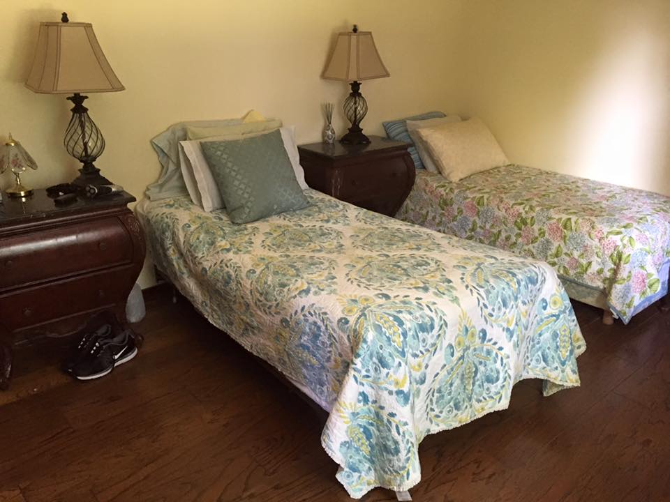 Private resident room with two beds and lamps