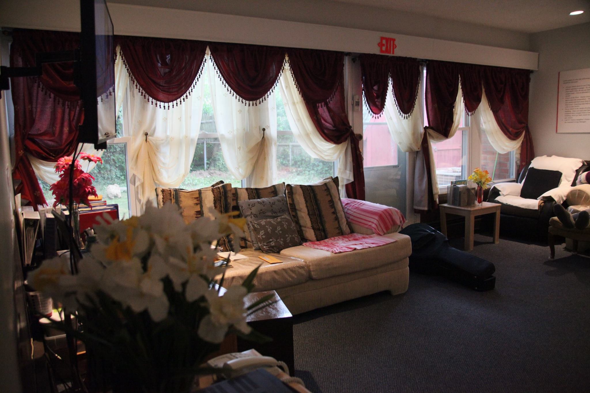 Cozy common area with seating and curtains