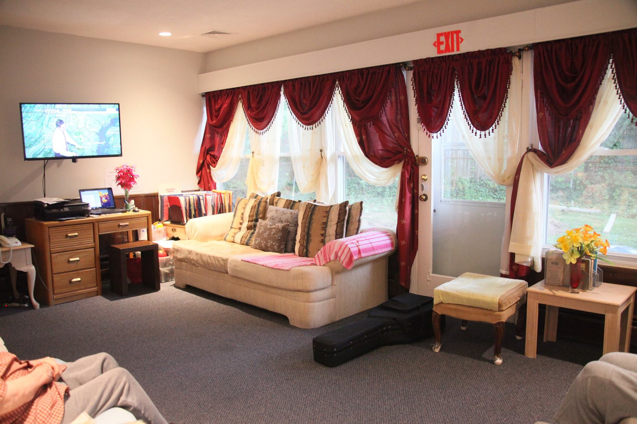 Cozy common area with a couch and TV