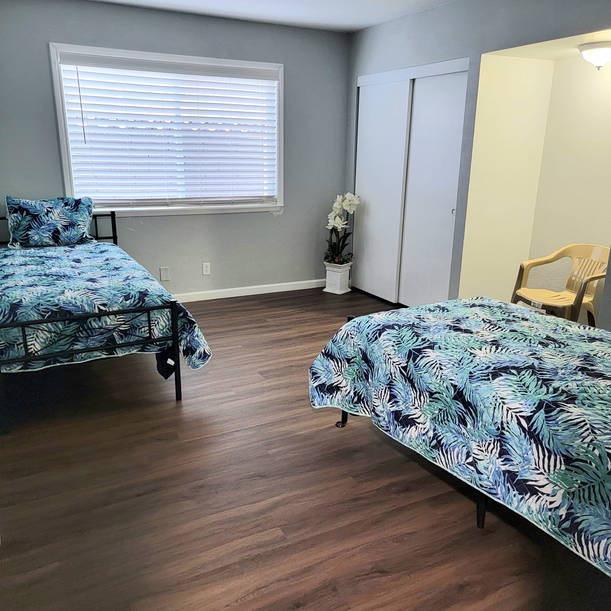 Private resident room with two beds and decor