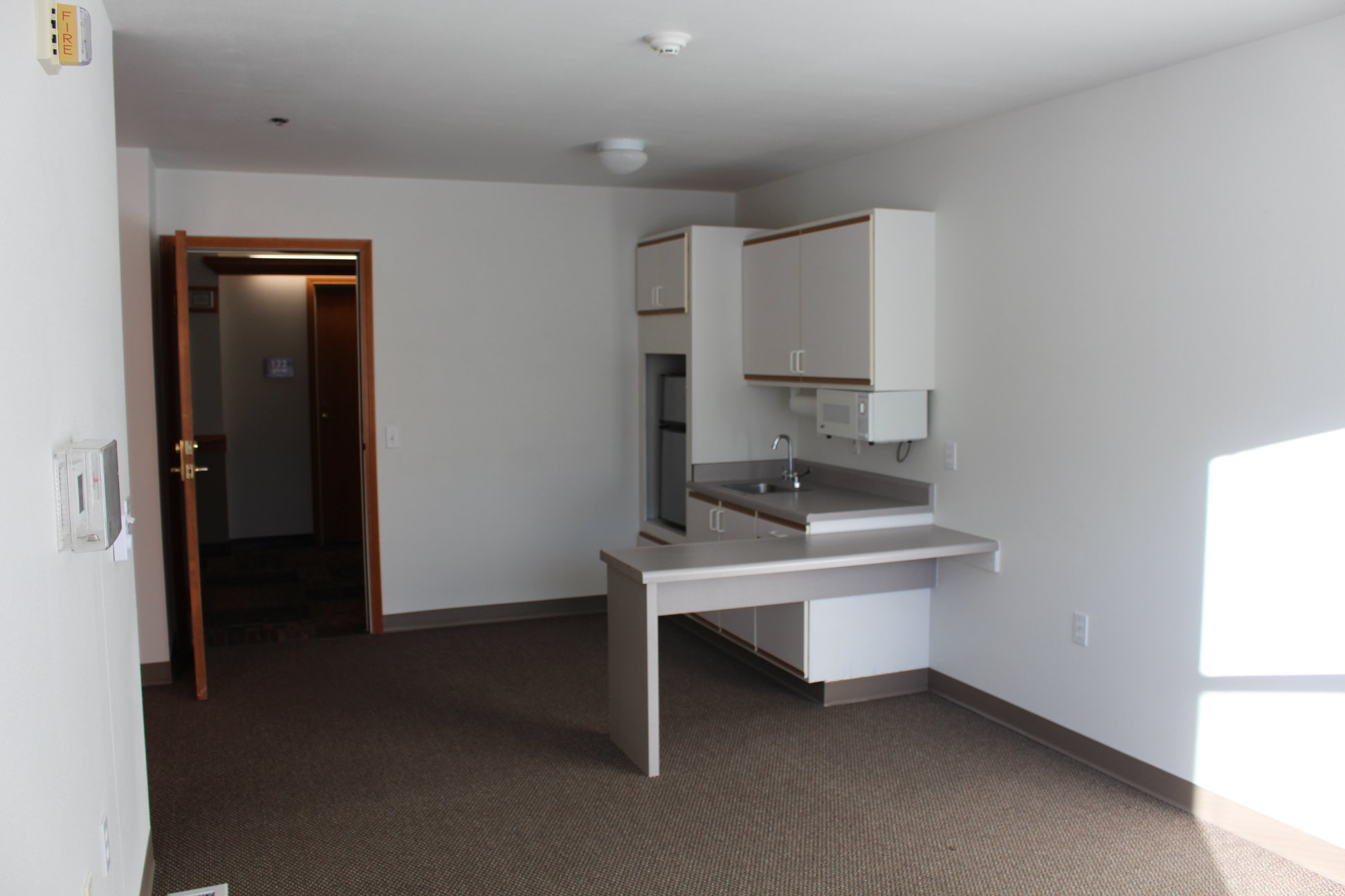 Interior view of a resident room with kitchenette
