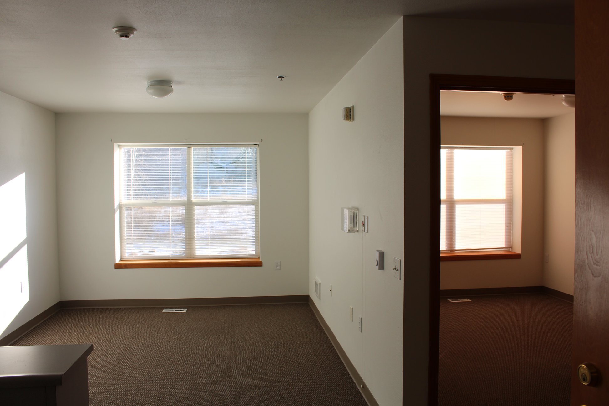 Bright, spacious interior view of a resident room