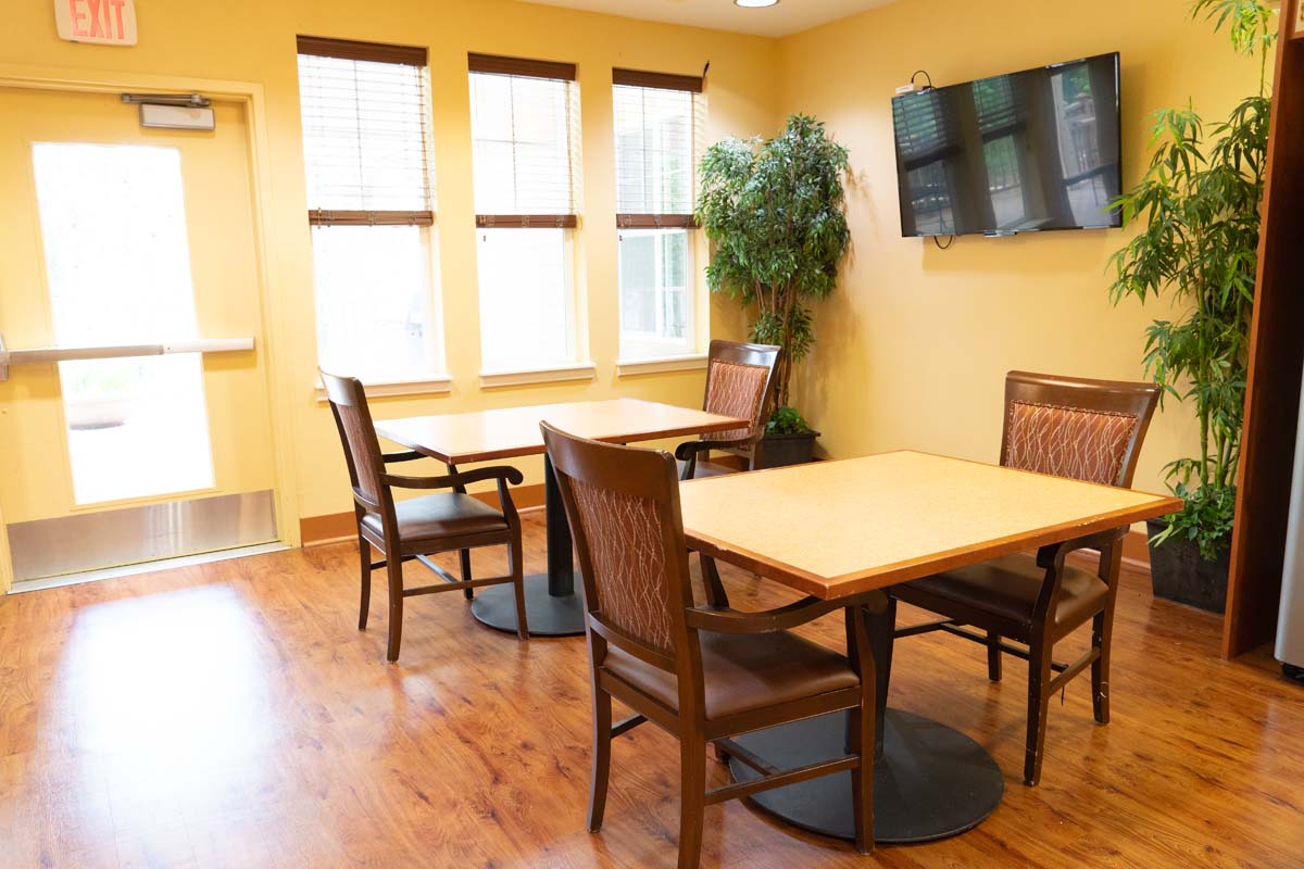 Bright common area with tables and chairs