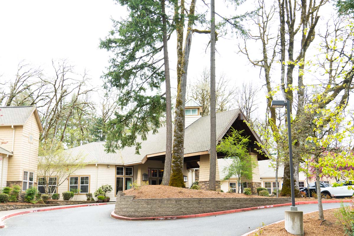 Exterior view of the facility with trees and landscaping