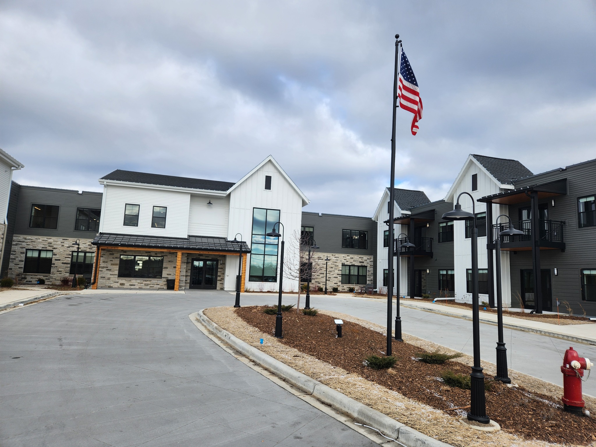 Exterior view of Azura Memory Care facility with landscaping
