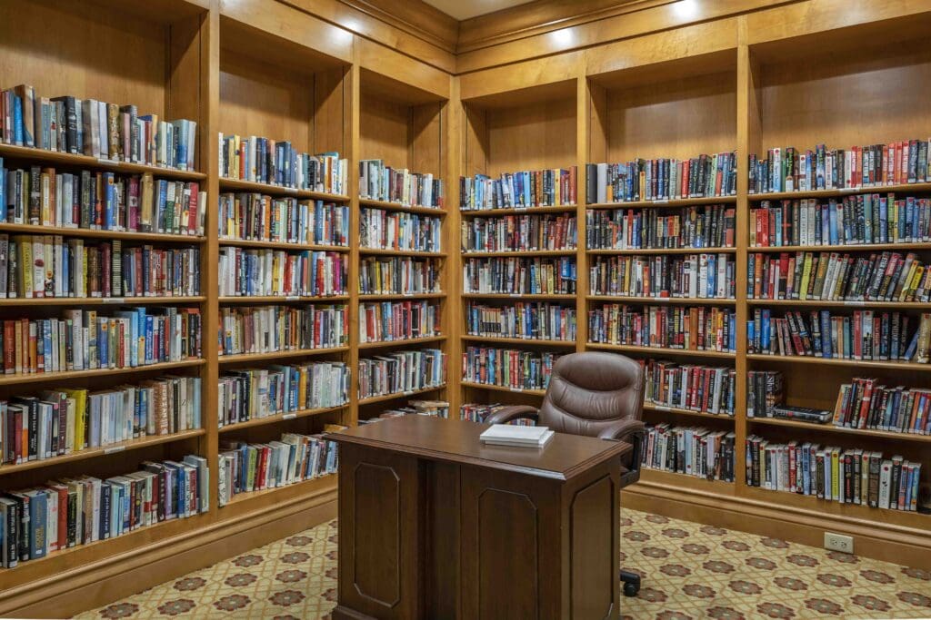 Cozy library with wooden shelves full of books