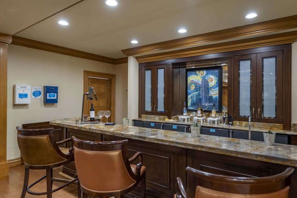 Bar area with seating in a well-lit lounge