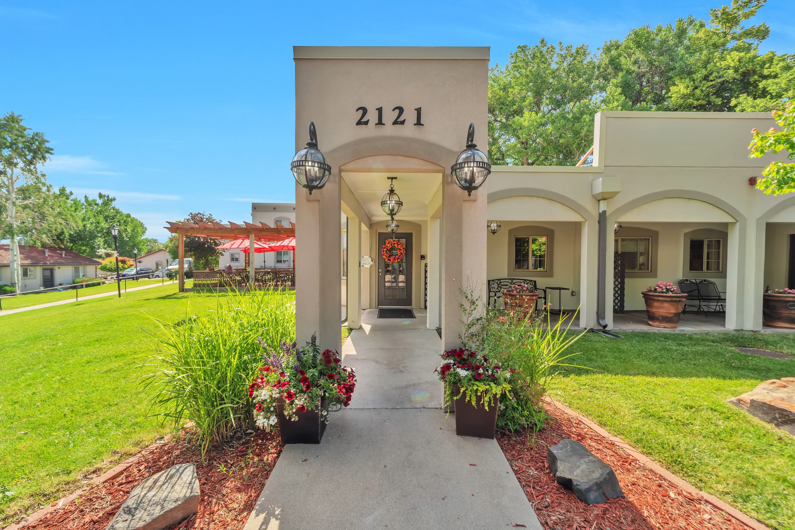 Entrance of a senior living facility with landscaping