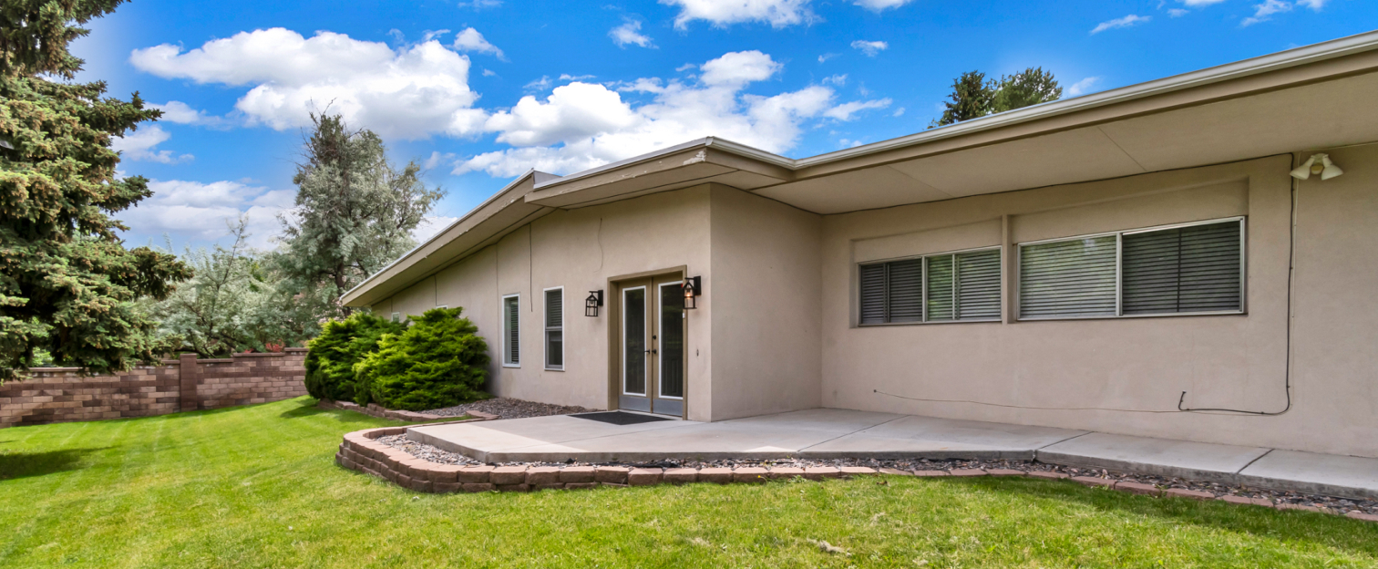 Exterior view of a senior living building and outdoor space