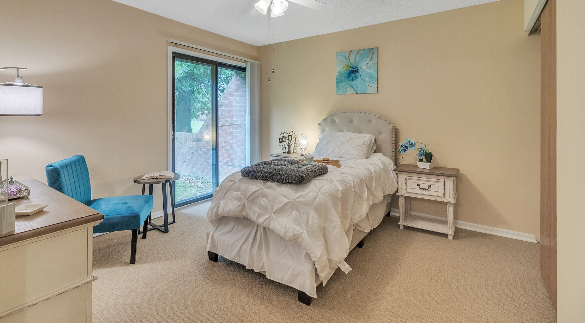 Cozy resident room with a bed and window view