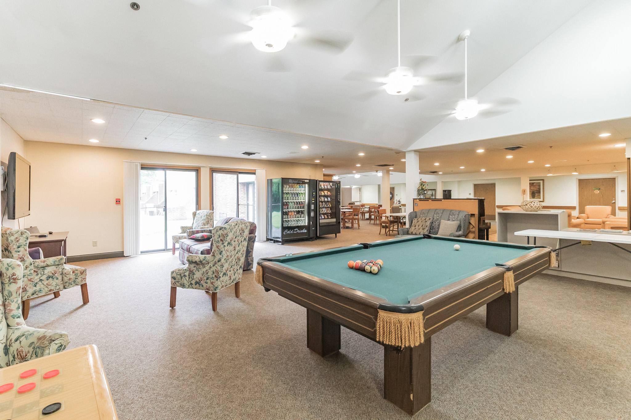 Common area with a pool table and seating