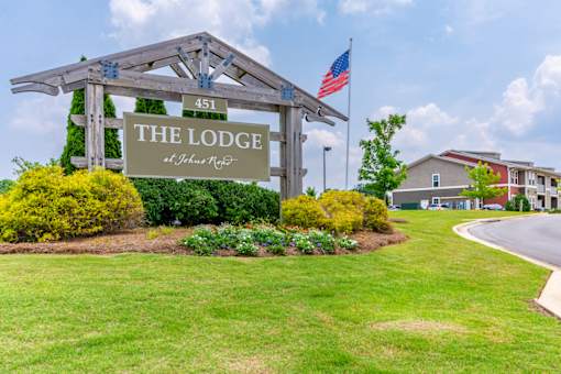 Exterior view of The Lodge at Johns Rd with signage