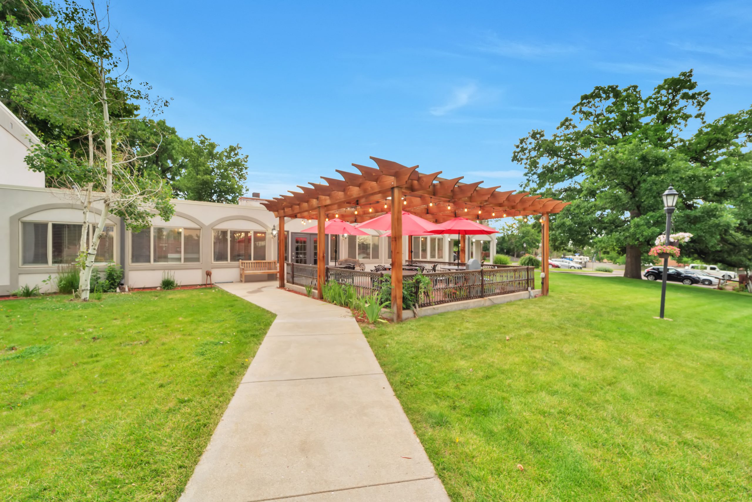 Outdoor dining area with patio and lawn