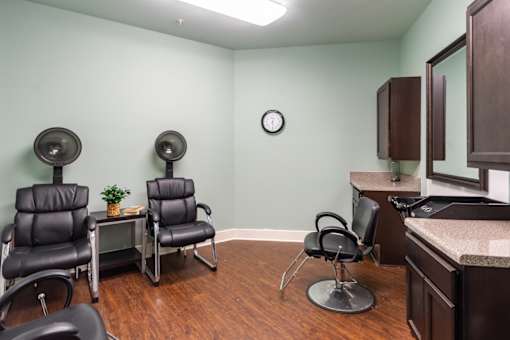 Interior view of a hair salon area with styling chairs