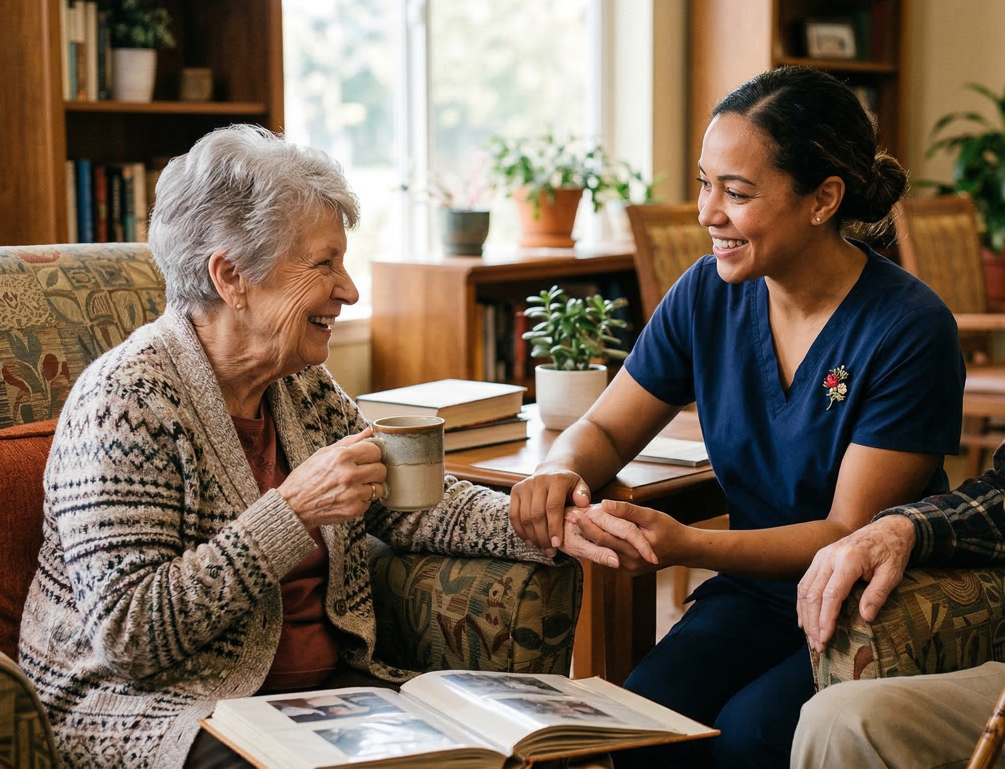 Staff member engaging with a resident in a cozy common area