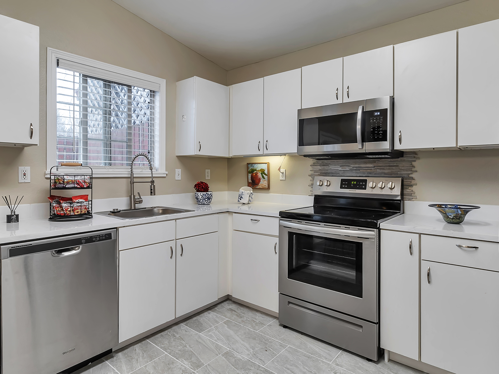 Bright kitchen with modern appliances and cabinetry