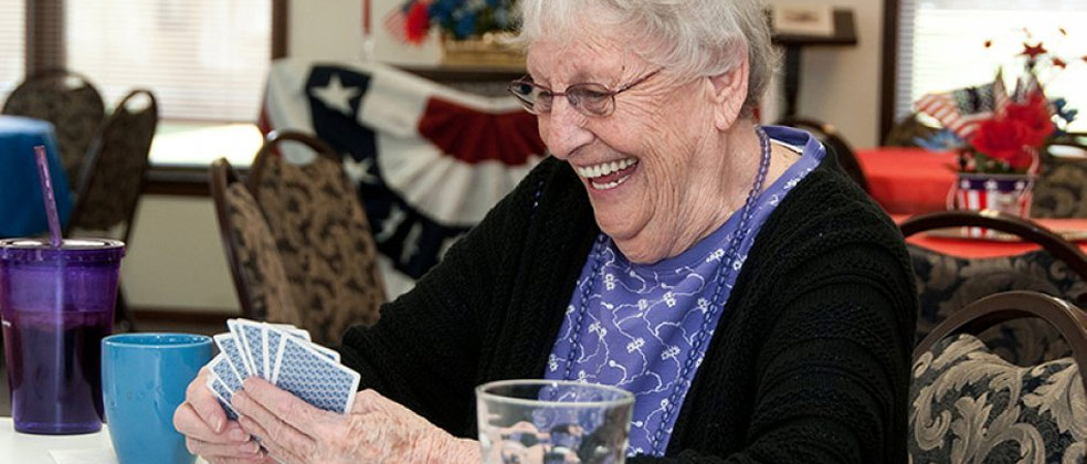 Resident enjoying a card game in a common area