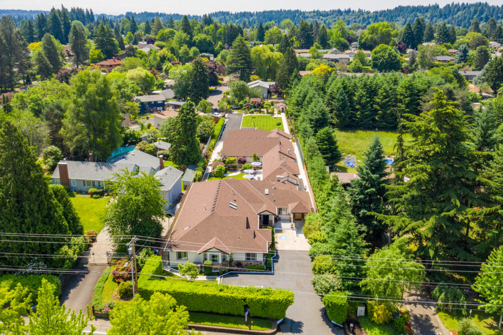 Aerial view of Mapleview Manor and surrounding greenery.