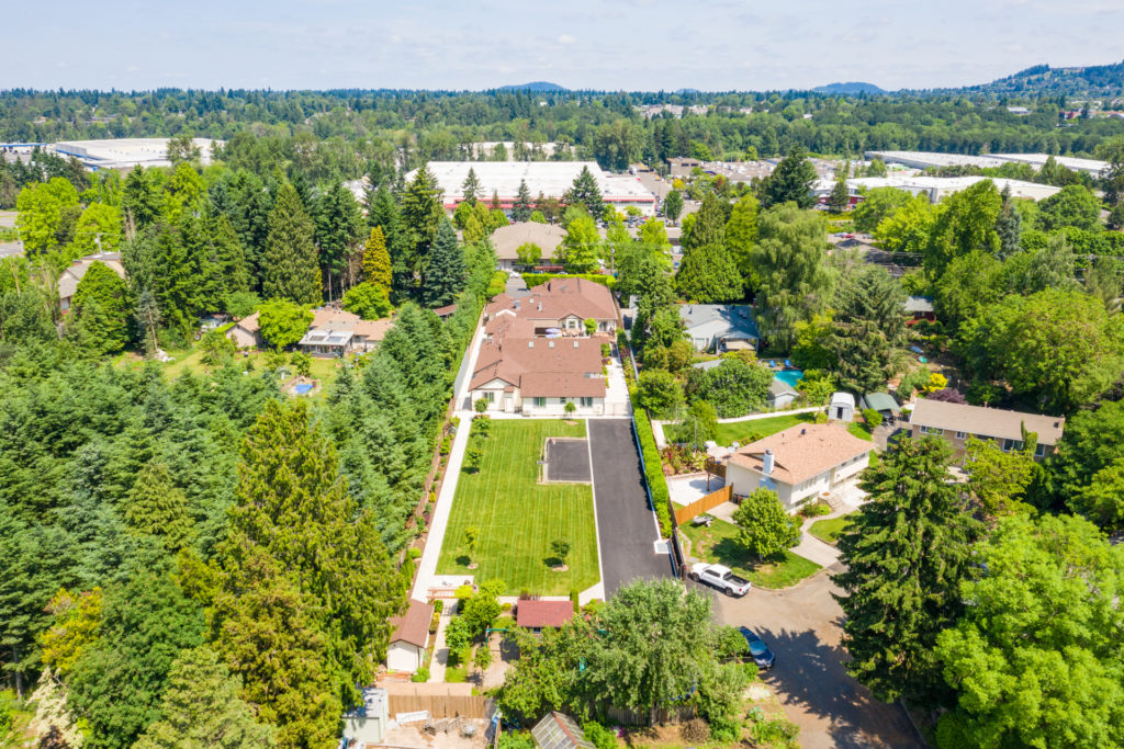 Aerial view of Mapleview Manor and surrounding greenery.