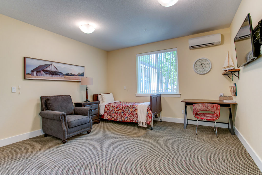 Cozy resident room with bed and seating