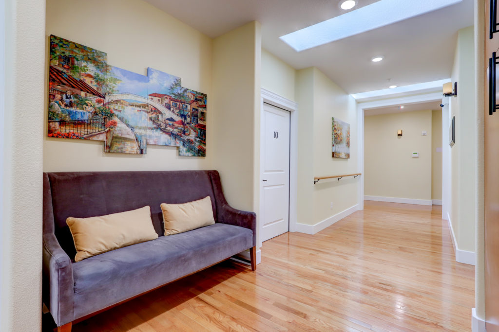 Interior hallway with artwork and seating
