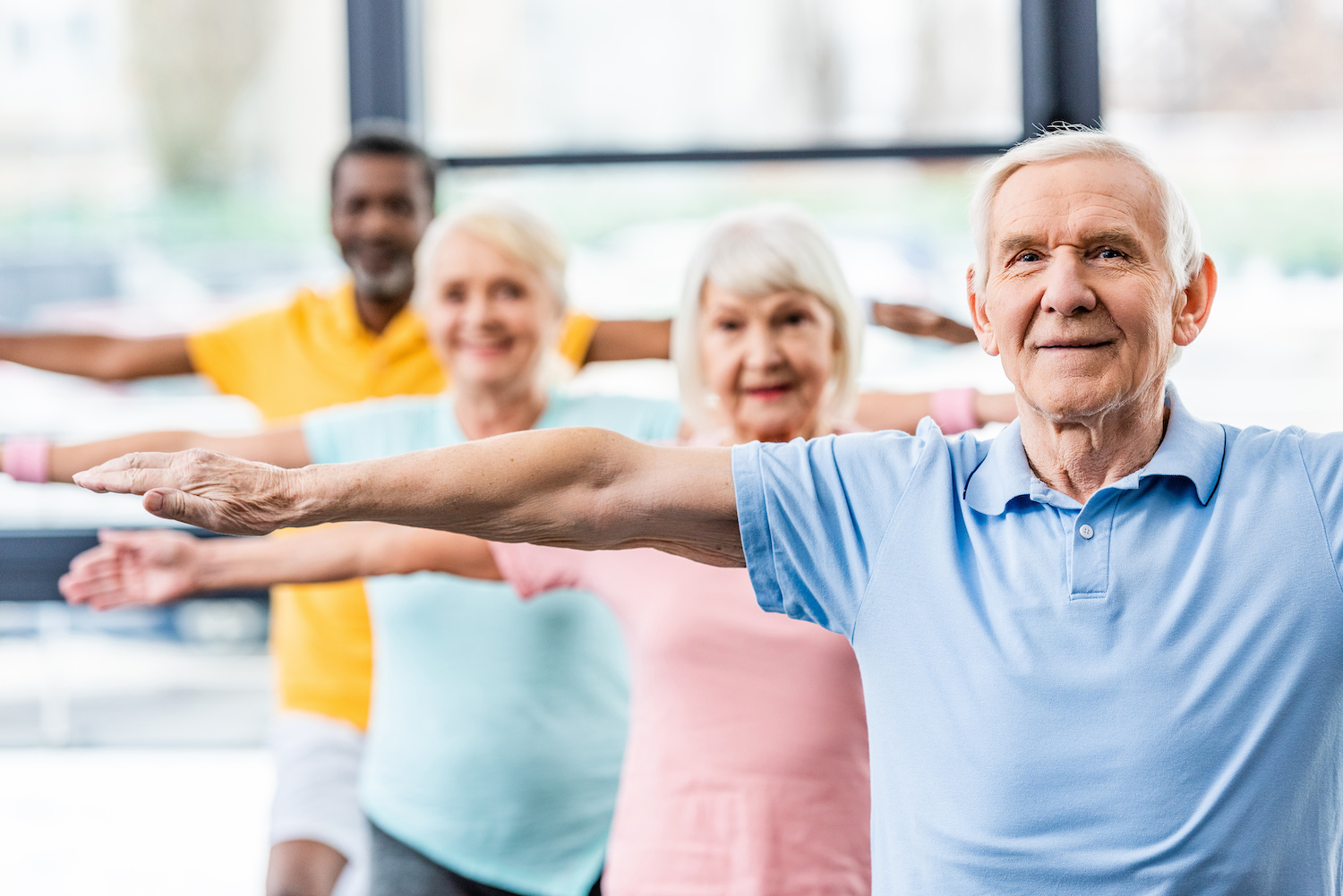 Seniors participating in a fitness class indoors