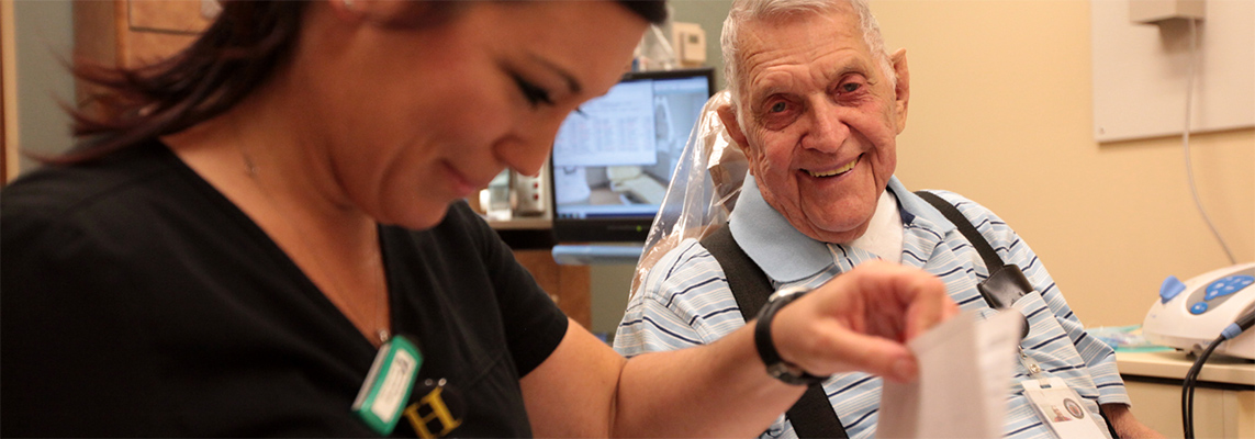 Resident and staff member engaged in interaction