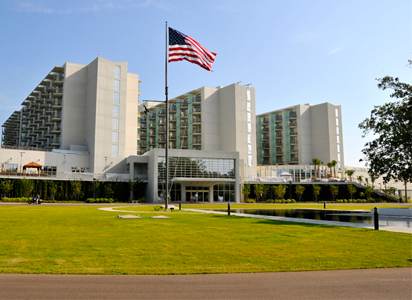 Exterior view of the facility with an American flag