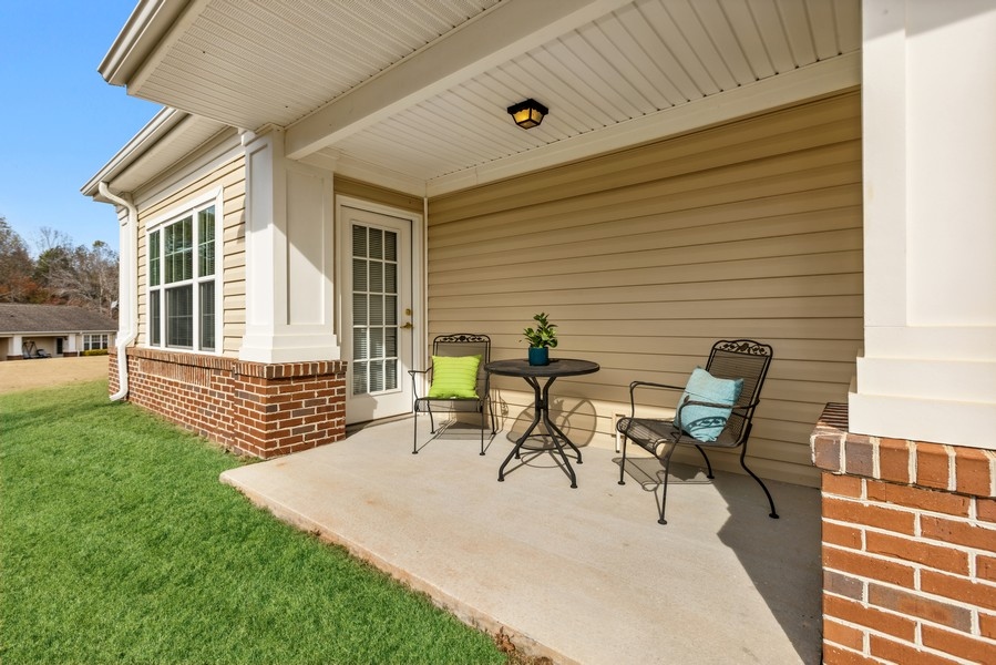 Outdoor seating area with chairs and table