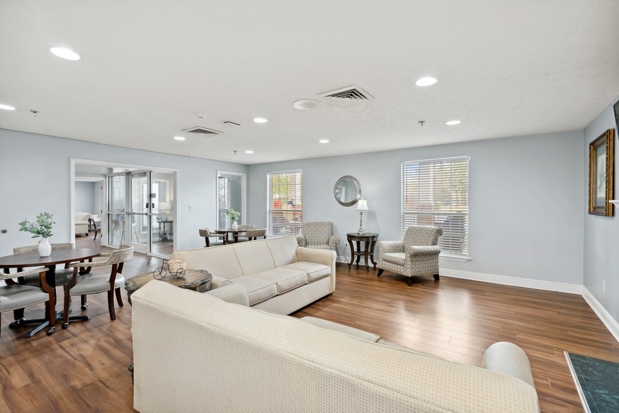 Bright common area with seating and dining tables