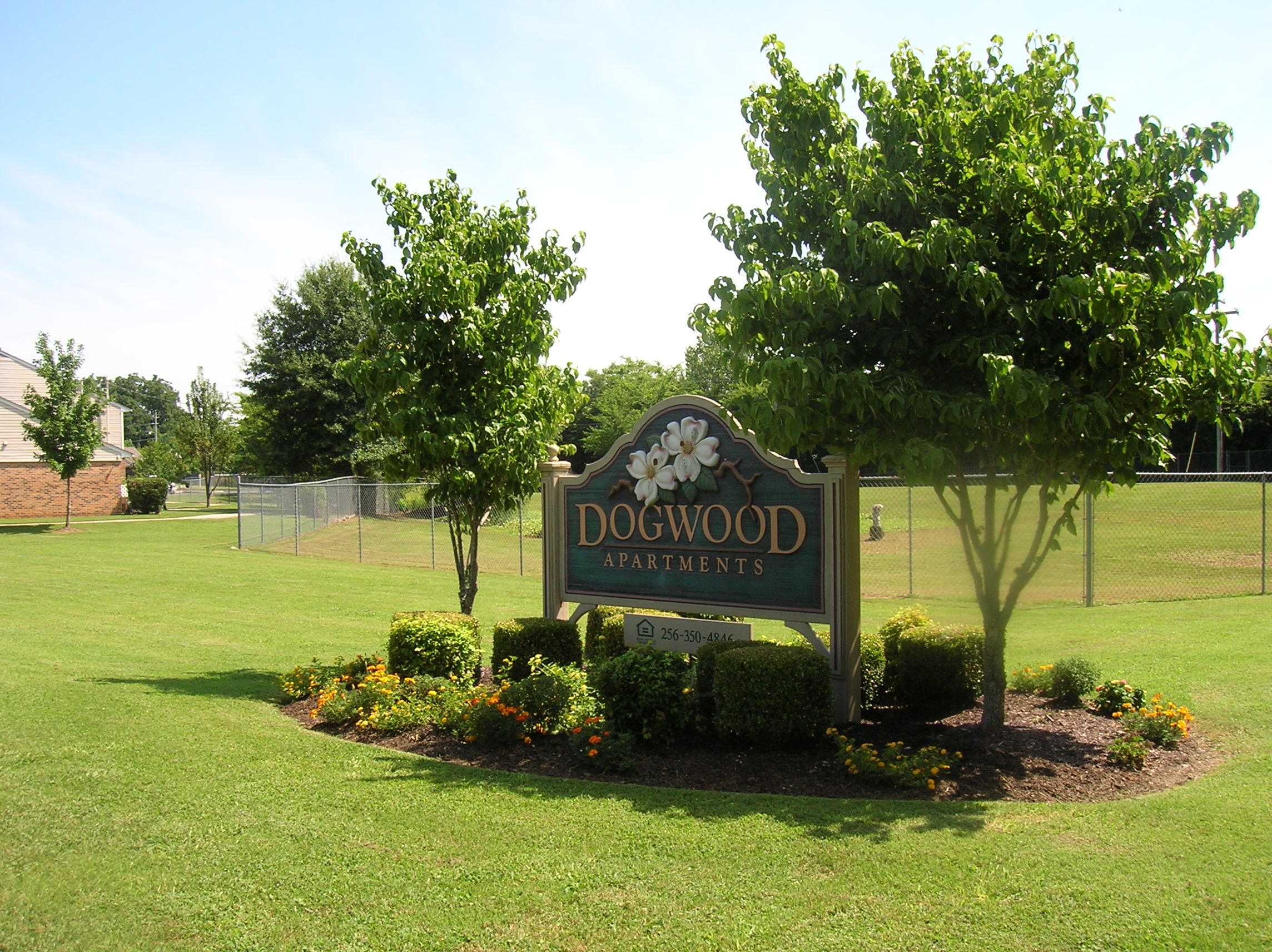 Signage for Dogwood Apartments in a landscaped area.