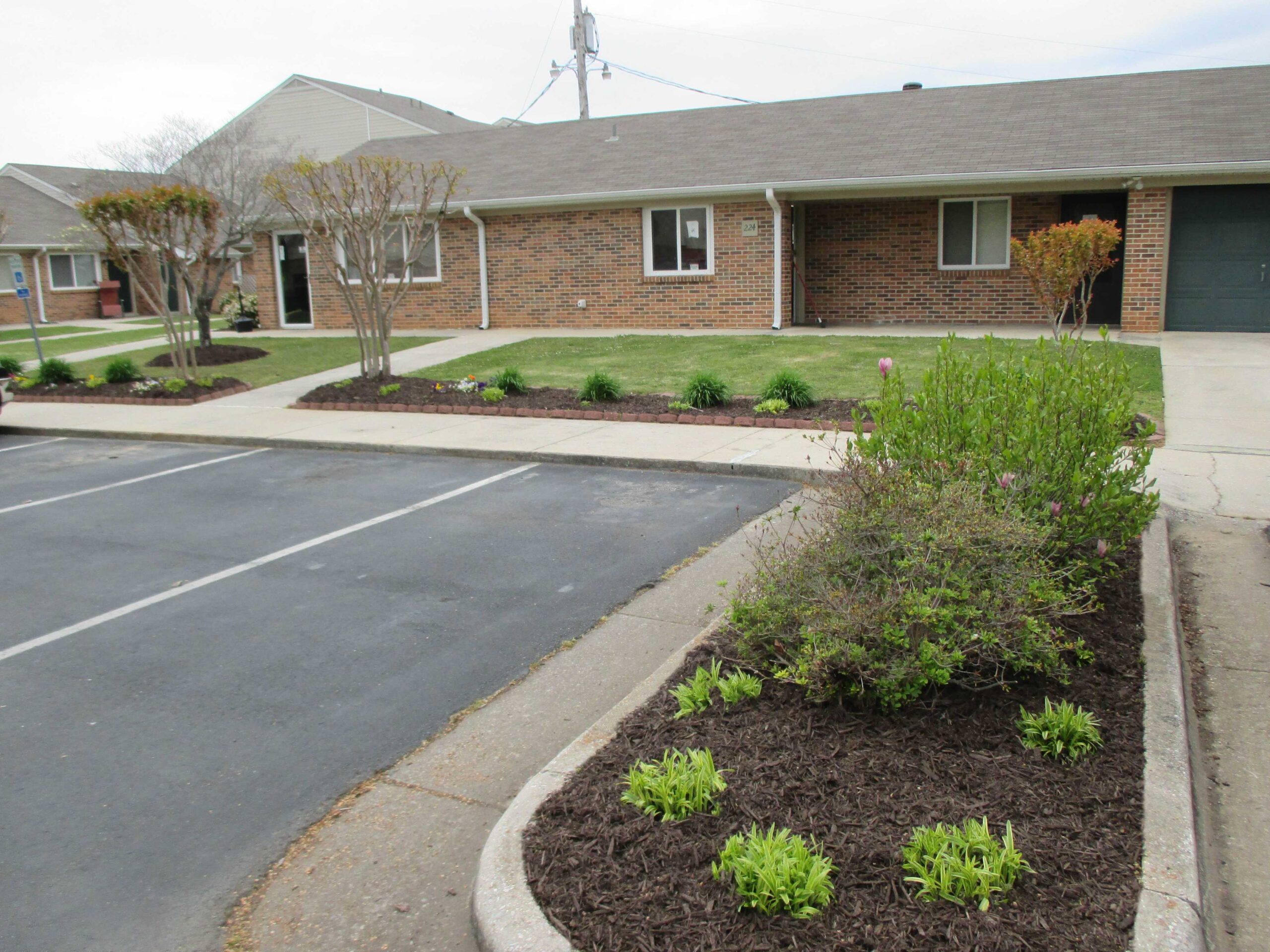 Exterior view of Dogwood Apartments with landscaped area