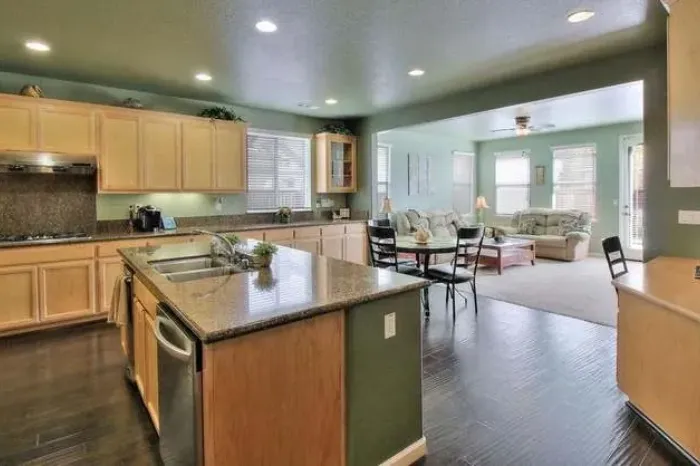 Bright kitchen area with seating and living space