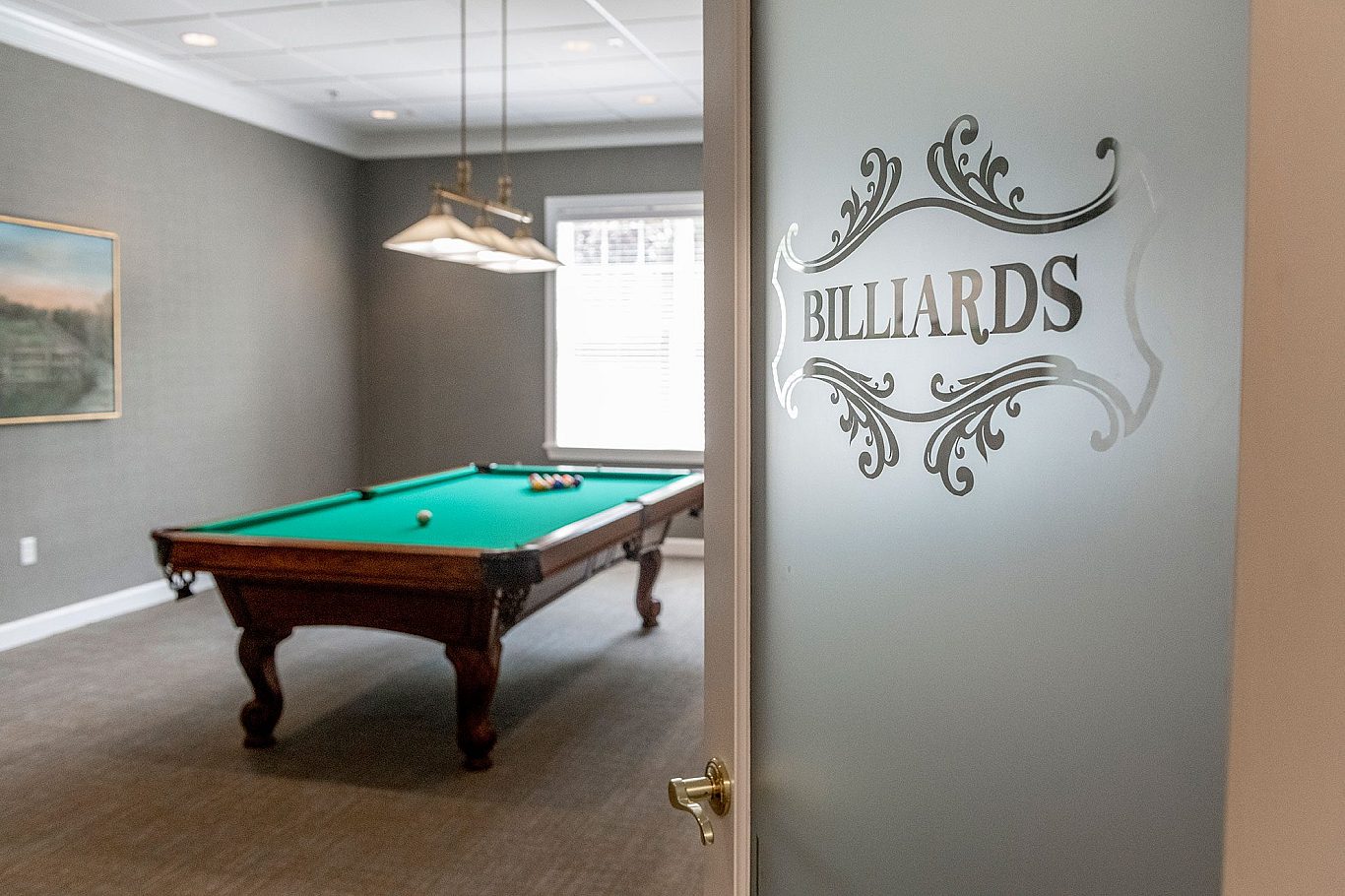 Interior billiards room with a pool table