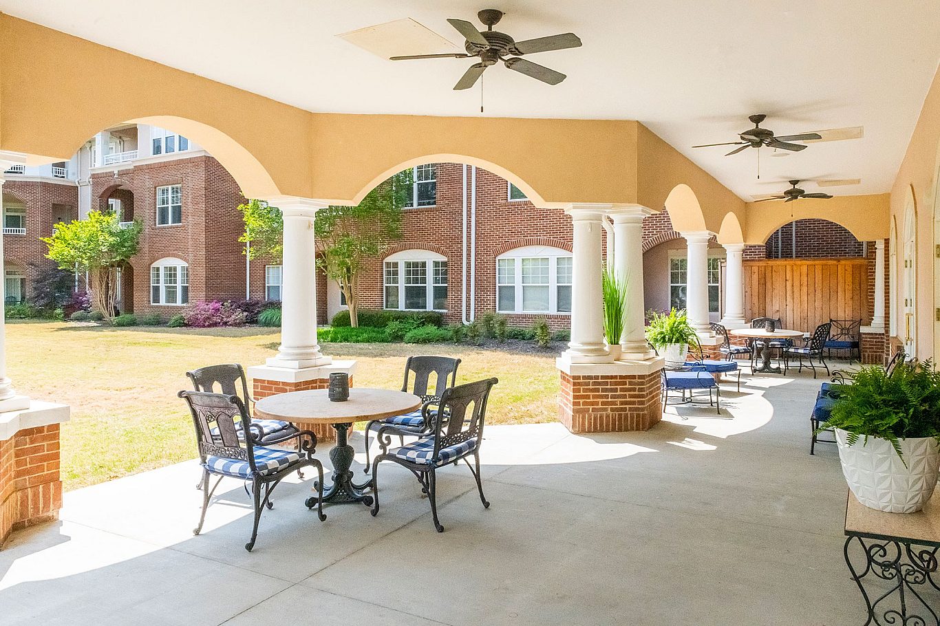 Outdoor seating area with tables and chairs