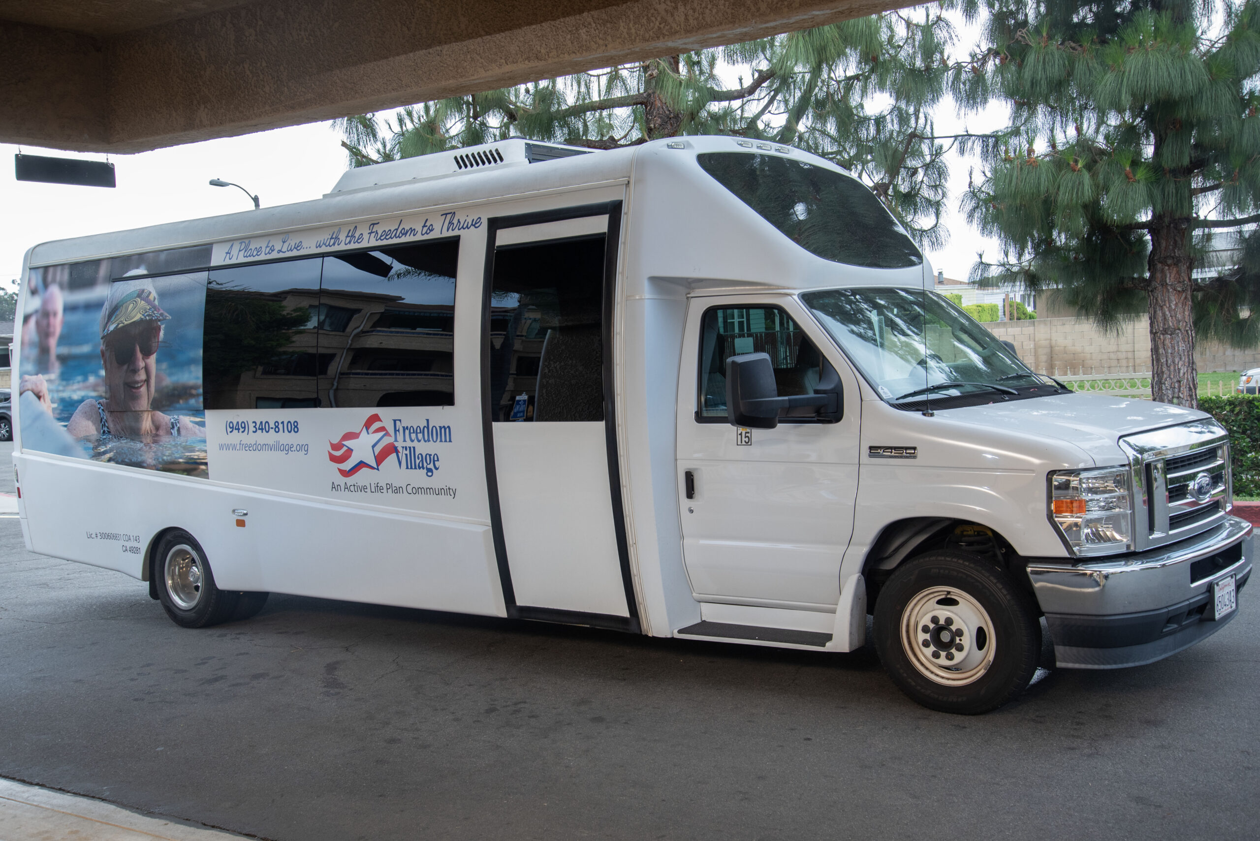 Facility transport van with logo visible