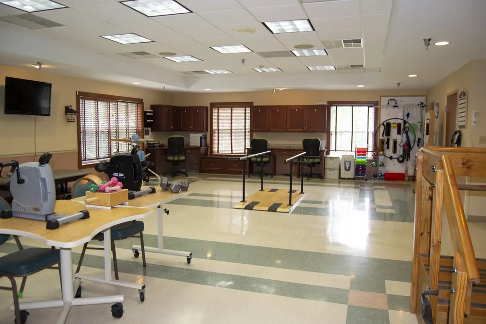 Spacious occupational therapy room with equipment