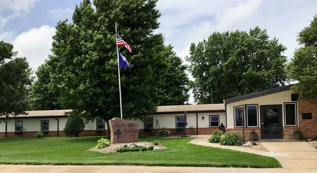 Exterior view of Parkview Haven Nursing Home with outdoor flag.