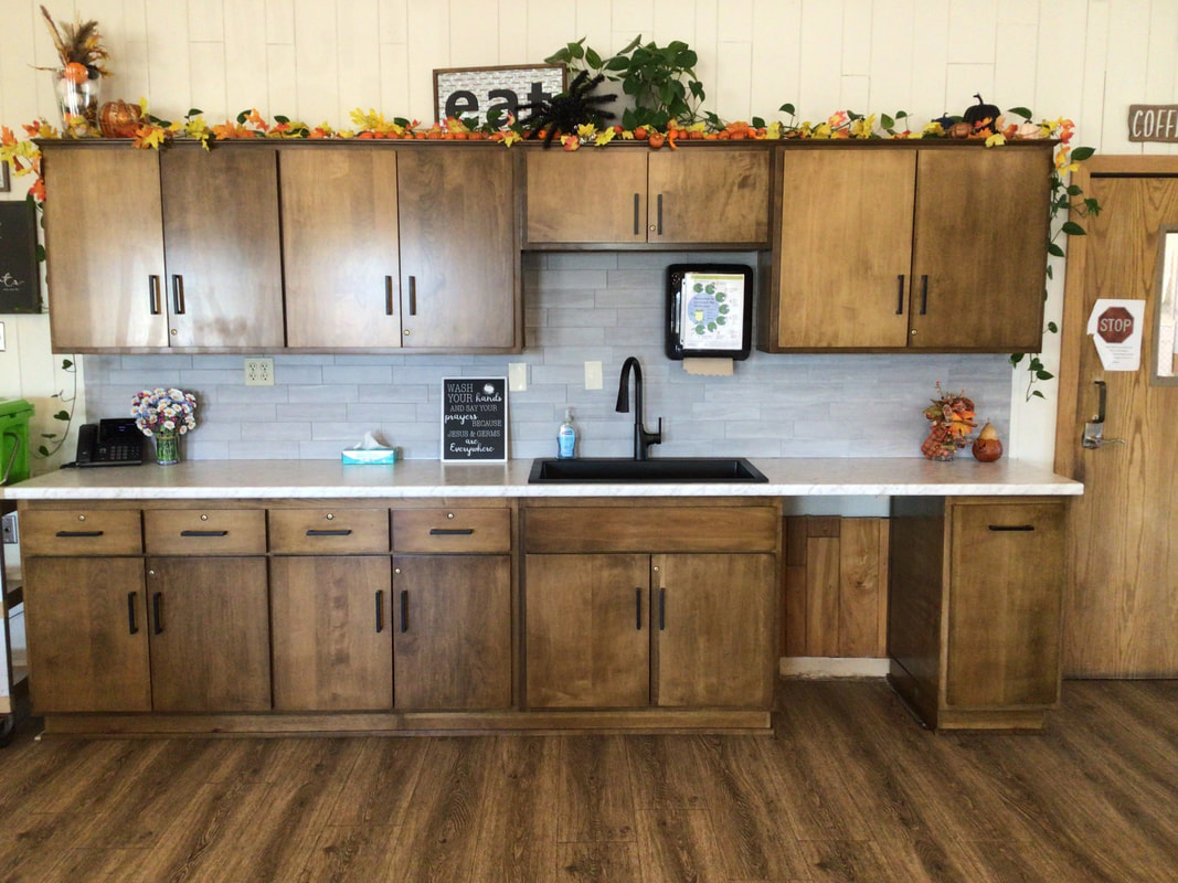 Interior view of a kitchen space with cabinets