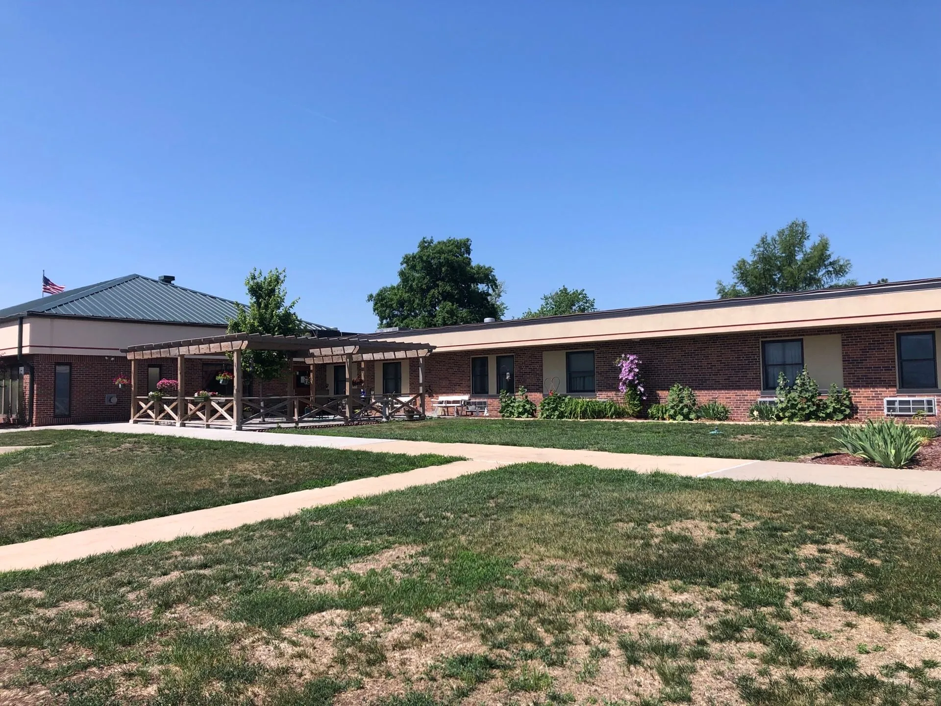 Exterior view of Wilber Care Center with garden and walkways