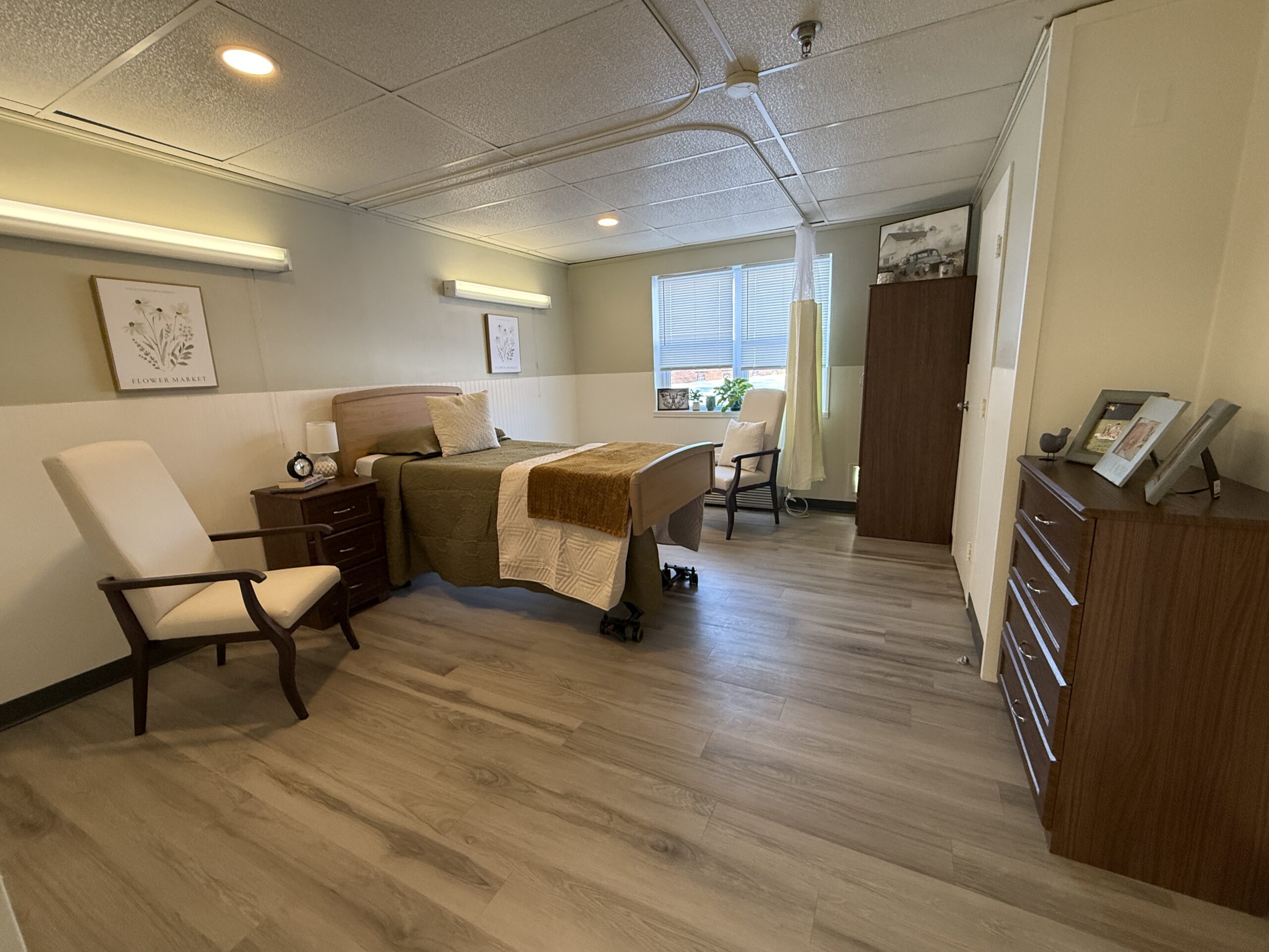 A private resident room with bed and furnishings