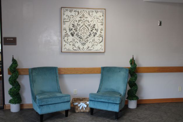 Seating area with decorative chairs and wall art