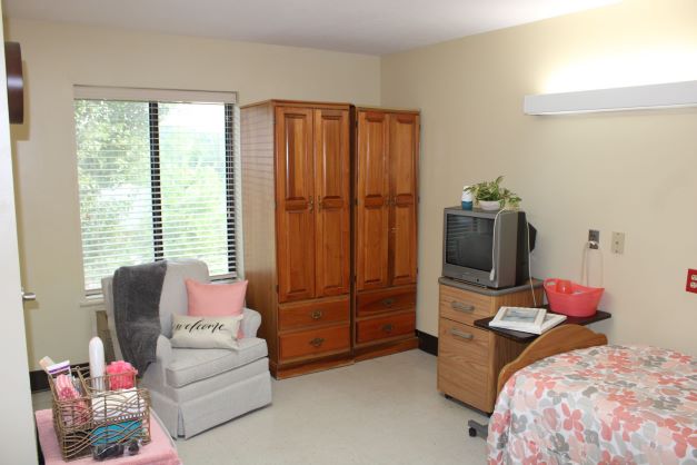 Cozy resident room with a bed and furniture